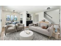 Inviting living room featuring comfortable seating, modern decor, and seamless flow to the dining area at 4228 N 81St St, Scottsdale, AZ 85251