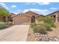 Inviting single-story home with a desert-landscaped front yard and two car garage at 10226 E Pine Valley Rd, Scottsdale, AZ 85255