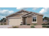 Charming single-story home featuring a neutral color scheme, two car garage, and low maintenance desert landscaping at 15755 W Camden Ave, Waddell, AZ 85355