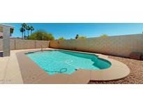 Refreshing in-ground pool with clear blue water and ample space for relaxation and entertainment at 16537 N Oachs Dr, Surprise, AZ 85374