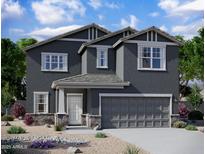 Charming two-story home featuring a two-car garage and a welcoming covered porch entrance at 47186 W Coe St, Maricopa, AZ 85139