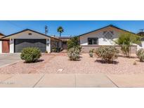Charming single-story home featuring a low-maintenance yard and decorative accents over the brickwork at 554 N Sunset Dr, Chandler, AZ 85225