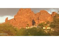 Scenic view of Camelback Mountain with lush desert landscaping and the soft glow of sunset lighting at 5625 N 45Th St, Phoenix, AZ 85018