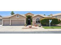 Charming single-story home with a well-maintained front yard and desert landscaping at 758 S Lagoon Dr, Gilbert, AZ 85233