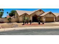 Single-story home with well-manicured desert landscaping and an attached two-car garage at 9109 W Watson Ln, Peoria, AZ 85381