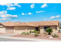 Charming single story home featuring a 2-car garage and desert landscaping for low maintenance appeal at 9814 W Menadota Dr, Peoria, AZ 85382