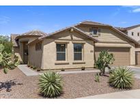 Charming single-story home showcasing desert landscaping, neutral colors, and a well-maintained front yard at 1415 N Frederick Ln, Casa Grande, AZ 85122