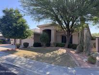 Charming single-story home featuring desert landscaping and a covered front entrance at 20609 N 57Th Dr, Glendale, AZ 85308