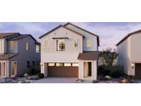 Charming two-story home with a two-car garage and a well-manicured front yard at 26421 N 24Th Gln, Phoenix, AZ 85085