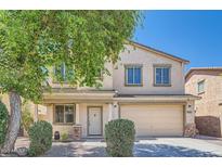 Charming two-story home featuring a two-car garage, a landscaped front yard, and traditional architectural details at 3719 E Longhorn St, San Tan Valley, AZ 85140