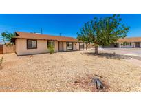 Cozy single-story home featuring a low-maintenance rock yard and mature shade tree at 7360 N 38Th Dr, Phoenix, AZ 85051