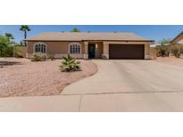 Charming single-story home with a two-car garage, desert landscaping, and a welcoming entrance at 846 N 81St St, Mesa, AZ 85207