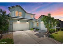 Beautiful two-story home featuring a three-car garage and manicured front lawn at 10144 E Toledo Ave, Mesa, AZ 85212