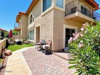 Inviting patio area with lush greenery surrounding the cozy outdoor seating area at 10229 N 12Th Ct # 1, Phoenix, AZ 85020