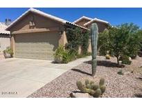 Charming home showcasing desert landscaping and a two-car garage at 2110 E Williams Dr, Phoenix, AZ 85024