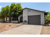Charming single-story home with well-maintained landscaping and a one-car garage at 3039 W Ross Ave, Phoenix, AZ 85027