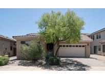 Charming single-story home featuring a tile roof, desert landscaping, and a two-car garage at 3439 W Darien Way, Phoenix, AZ 85086