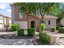 Charming two-story home with landscaped front yard and covered front porch at 4743 E Laurel Ave, Gilbert, AZ 85234