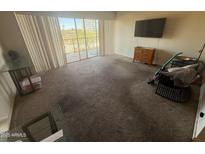 Spacious living room with sliding glass doors for natural light and outdoor access at 4750 N Central Ave # 3S, Phoenix, AZ 85012