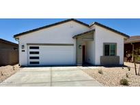 Charming single-story home featuring a two-car garage, low-maintenance landscaping, and modern architectural details at 640 S Maricopa Rd, Florence, AZ 85132