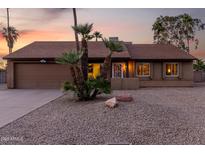 Charming single-Gathering home boasting a landscaped front yard and attached two-car garage at 6424 E Aire Libre Ln, Scottsdale, AZ 85254