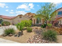Charming single-Gathering home with well-manicured landscaping, a two-car garage, and a tile roof at 719 W Milada Dr, Phoenix, AZ 85041
