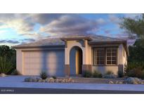 Charming single-story home featuring a two-car garage, an arched entryway, neutral color palette and desert landscaping at 8827 W Pasadena Ave, Glendale, AZ 85305
