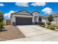 Charming single-story home with a well-manicured lawn and a two-car garage at 1281 W Highland Rd, San Tan Valley, AZ 85143