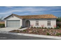 Charming single-story home with a two car garage and a beautifully landscaped front yard at 18203 E Zuza Dr, Gold Canyon, AZ 85118