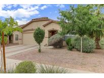Charming single-story home featuring desert landscaping and a tile roof at 218 E Milada Dr, Phoenix, AZ 85042