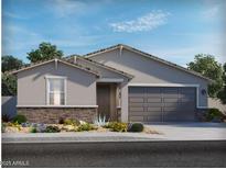Charming single-story home with gray stucco, brick accents, and desert landscaping in the front yard at 2604 E Grenache Rd, San Tan Valley, AZ 85143