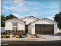 Charming single-story home featuring a brown two-car garage, stone accents, and desert landscaping at 2626 E Grenache Rd, San Tan Valley, AZ 85143