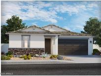 Charming single-story home with a stone veneer and neutral stucco, complemented by desert landscaping and a two-car garage at 2644 E Grenache Rd, San Tan Valley, AZ 85143
