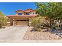 Charming two-story home with a two-car garage and desert landscaping at 298 W Dana Dr, San Tan Valley, AZ 85143