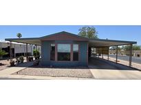 Charming single-story home features a covered carport and landscaped front yard, perfect for comfortable living at 3330 E Main St # 121, Mesa, AZ 85213