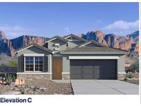 Charming single Gathering home with a two-car garage and attractive stone accents at 10608 W Sonrisas St, Tolleson, AZ 85353