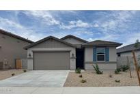 Charming single-story home with a two-car garage and low maintenance landscaping at 18374 W Poston Dr, Surprise, AZ 85387