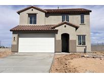 Charming two-story home featuring a two-car garage, tile roof, and neutral-toned stucco exterior at 20756 N 224Th Ave, Surprise, AZ 85387