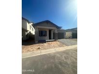 Charming single-story home featuring a brick-accented facade and a two-car garage on a sunny day at 3637 E Rochelle Cir, Mesa, AZ 85213