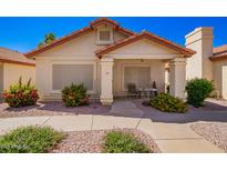 Charming single-story home with desert landscaping and a cozy front porch seating area at 1120 N Val Vista Dr # 113, Gilbert, AZ 85234