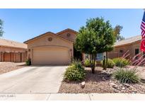 Charming single-story home featuring a desert-landscaped front yard and two-car garage at 1325 E Linda Dr, Casa Grande, AZ 85122