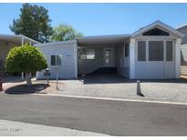 Charming single-story home featuring a covered parking and well-maintained landscaping in a peaceful neighborhood at 17200 W Bell Rd # 1279, Surprise, AZ 85374