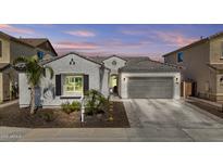 Charming single-story home with a two-car garage, desert landscaping and a neutral color scheme at 23097 N 95Th Dr, Peoria, AZ 85383