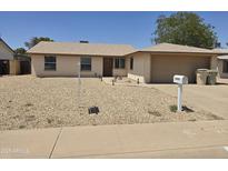 Charming single-story home featuring a low-maintenance desert landscape and inviting front entrance at 5608 W Carol Ave, Glendale, AZ 85302