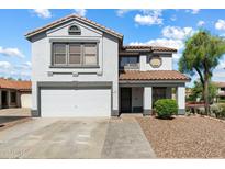 Charming two-story home with a well-maintained front yard and two car garage at 7500 E Deer Valley Rd # 54, Scottsdale, AZ 85255