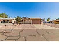 Charming single-story home with gravel landscaping and a quaint front entrance at 7849 E Golf Ave, Mesa, AZ 85209