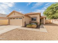 Charming single-story home with a well-maintained front yard and two-car garage at 10226 N 93Rd Dr, Peoria, AZ 85345