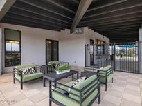 Beautiful patio area with stylish seating, perfect for relaxing and entertaining with great outdoor atmosphere at 16004 W Honeysuckle Dr, Surprise, AZ 85387
