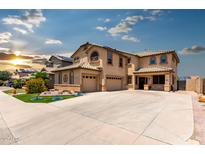 Stunning two-story home featuring a spacious driveway and well-manicured front yard at 16210 W Durango St, Goodyear, AZ 85338