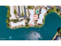 Stunning aerial view of lakeside condos with beautiful water views, pool, and convenient parking at 1825 W Ray Rd # 1119, Chandler, AZ 85224